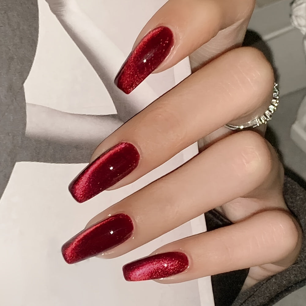 24pcs Stunning Red Cat Eye Press On Nails - Glossy Long Ballerina with Sparkling Finish; Includes Adhesive Tabs, Rubbing Strip, and Wooden Stick.