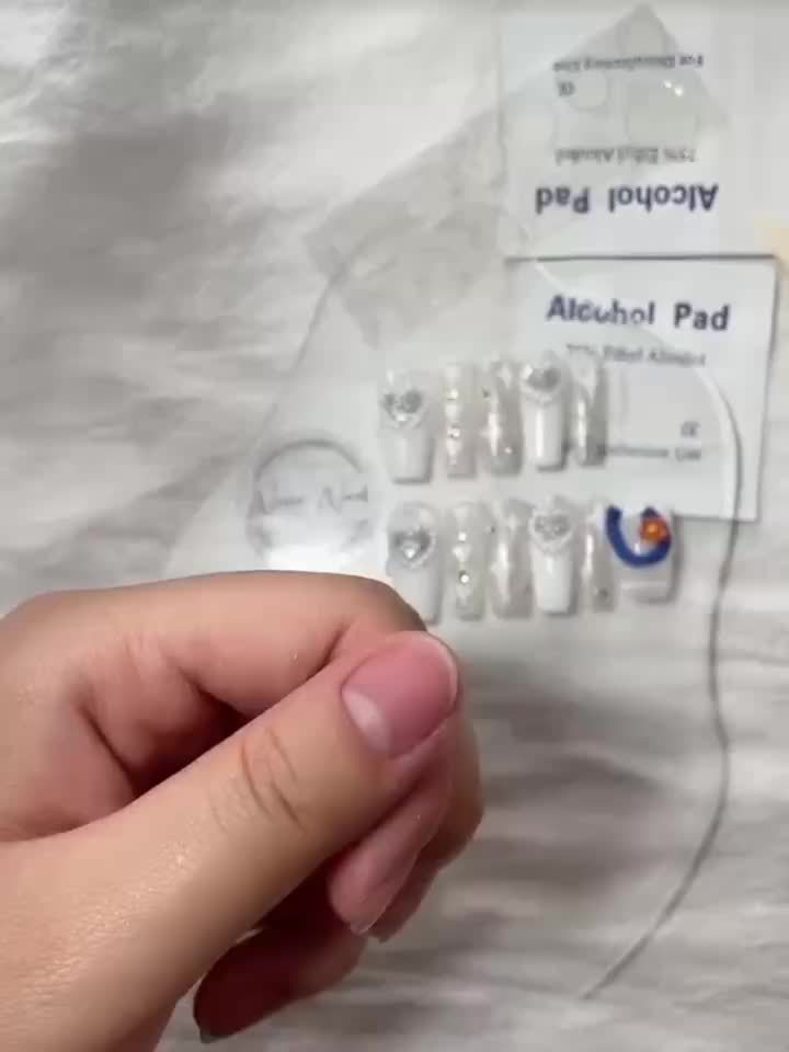 24pcs Stunning Red Cat Eye Press On Nails - Glossy Long Ballerina with Sparkling Finish; Includes Adhesive Tabs, Rubbing Strip, and Wooden Stick.